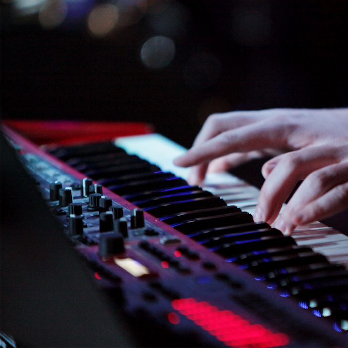Keyboard player hands on the stage