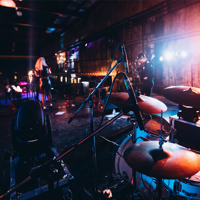 drum set at a party. musical instrument. club hall illuminated by spotlights.